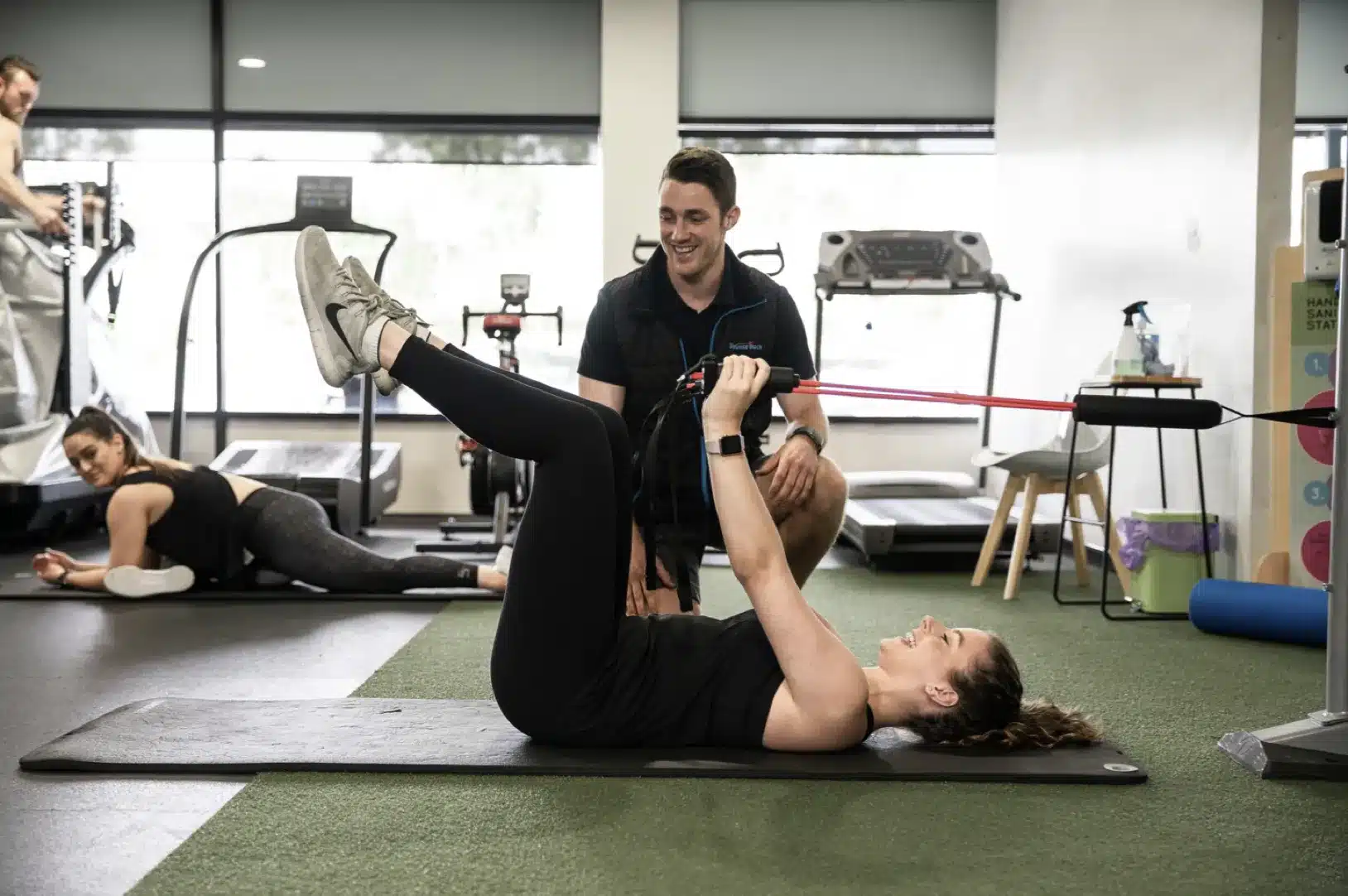 exercise physiologist instructing class on core exercise